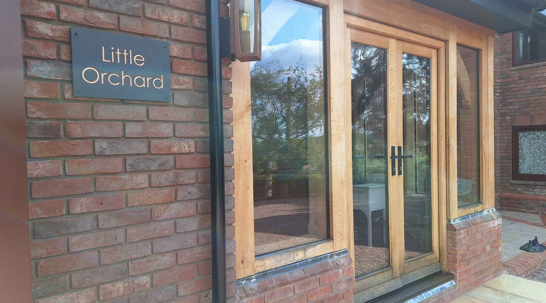 A charcoal and copper font sign installed