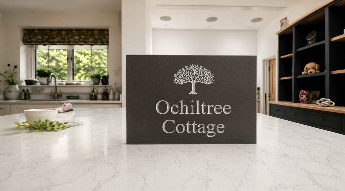 A Rectangle House Sign in Mink Stone with a Tree Motif and house name