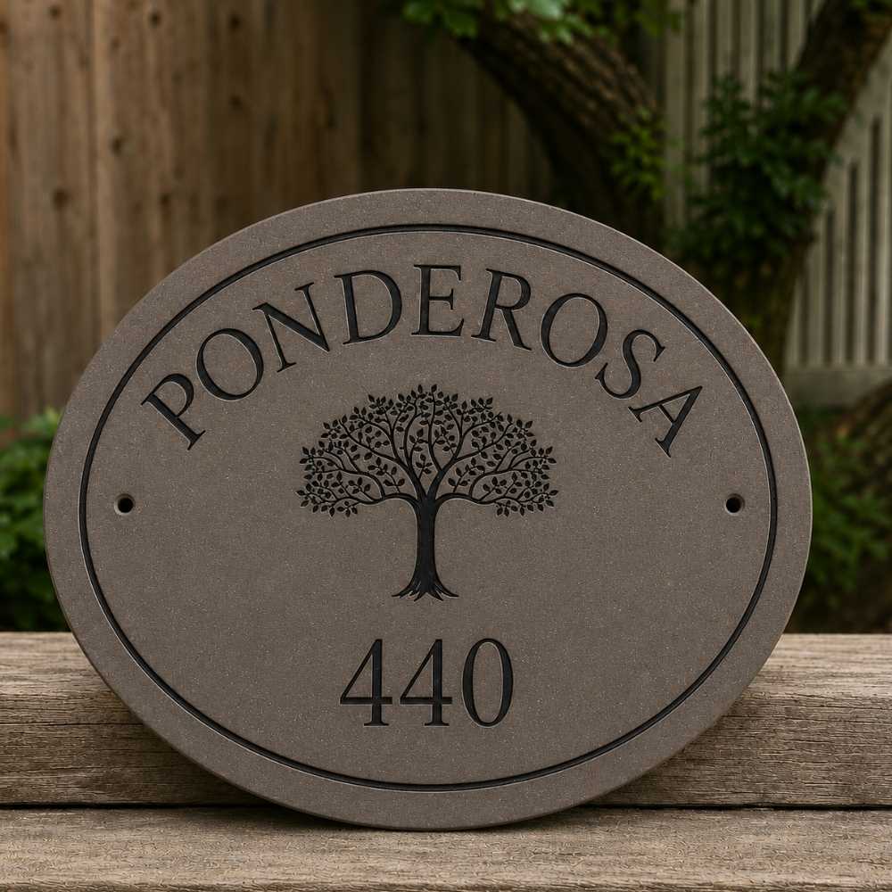 An oval mink house plaque with the name 'PONDEROSA' arched at the top, a tree graphic in the center, and the number '440' at the bottom, photographed outdoors on a wooden surface with a fence and greenery in the background.