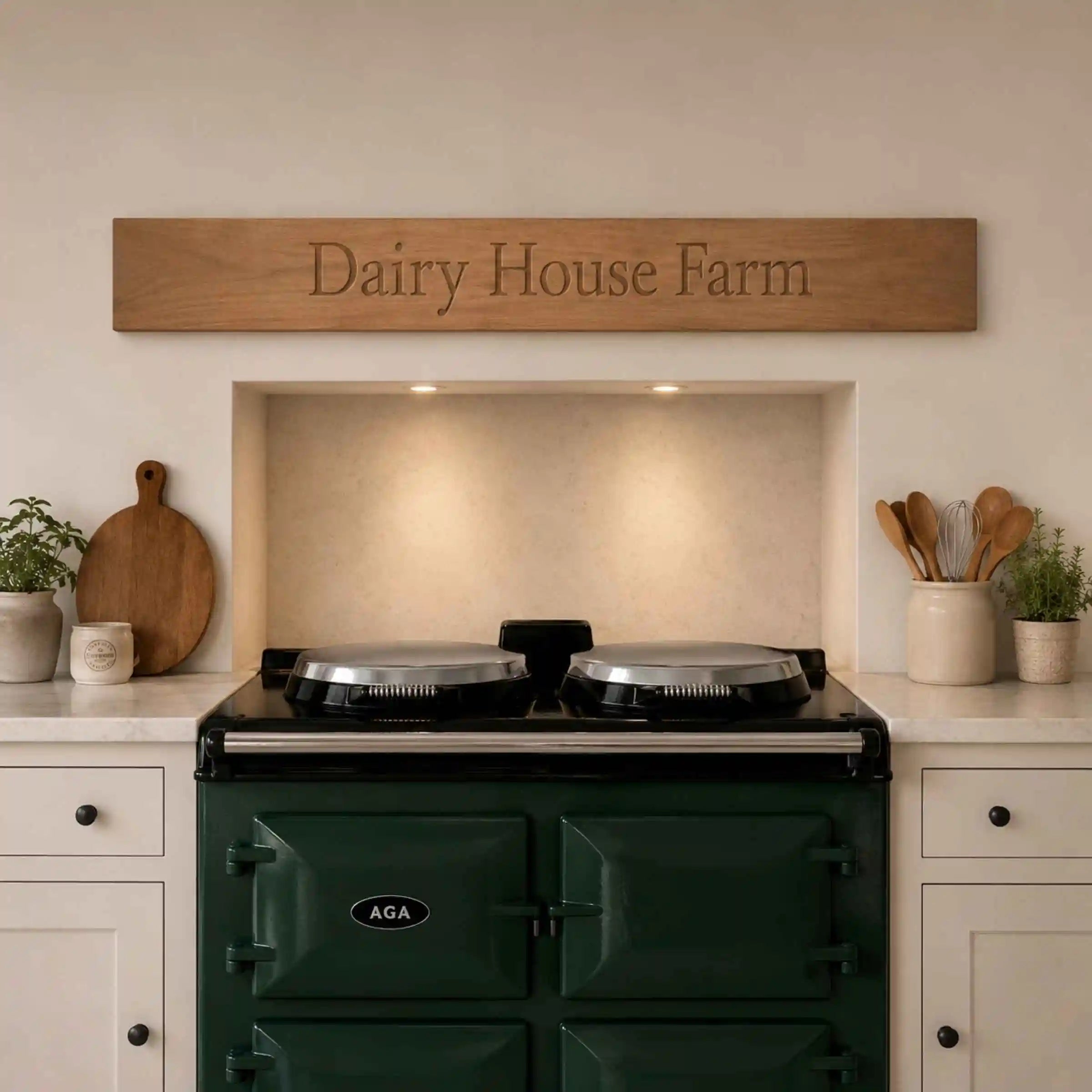 Green AGA stove in a kitchen with 'Dairy House Farm' sign above.