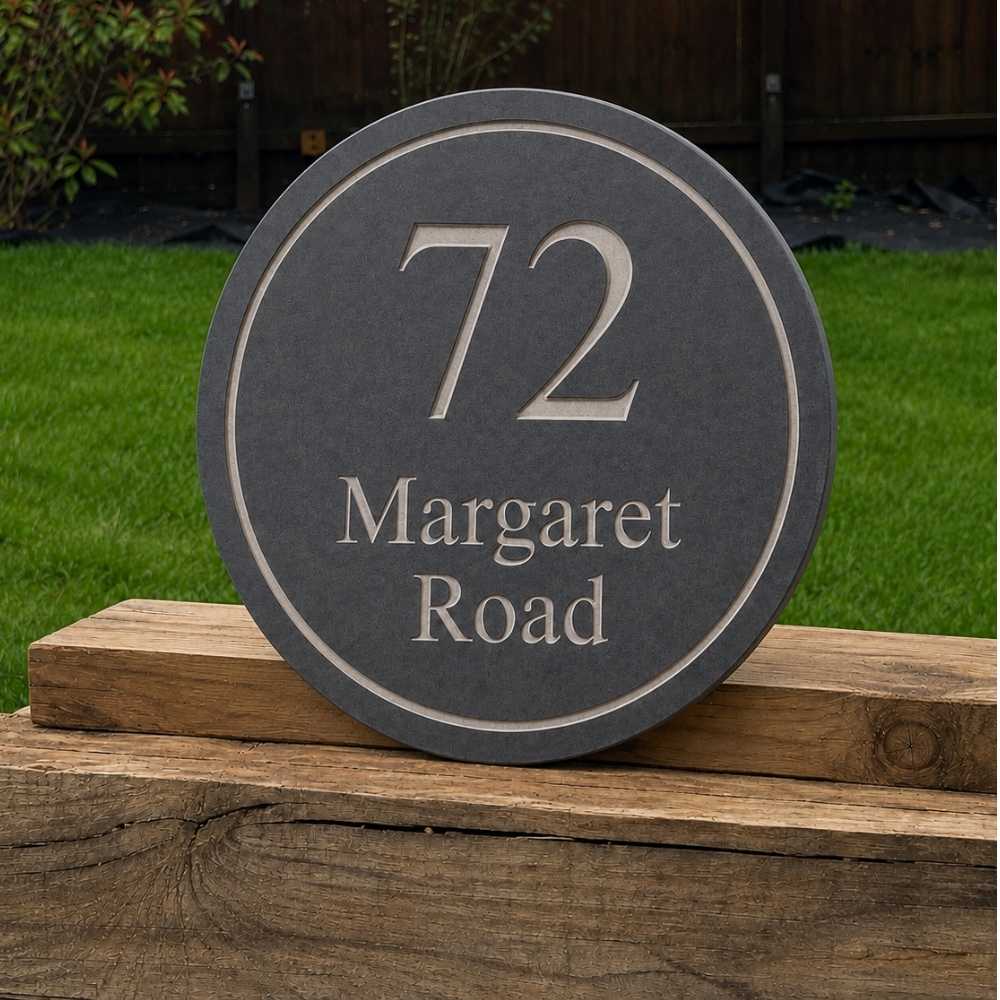 A round slate house number plaque reading '72 Margaret Road' in raised light lettering.