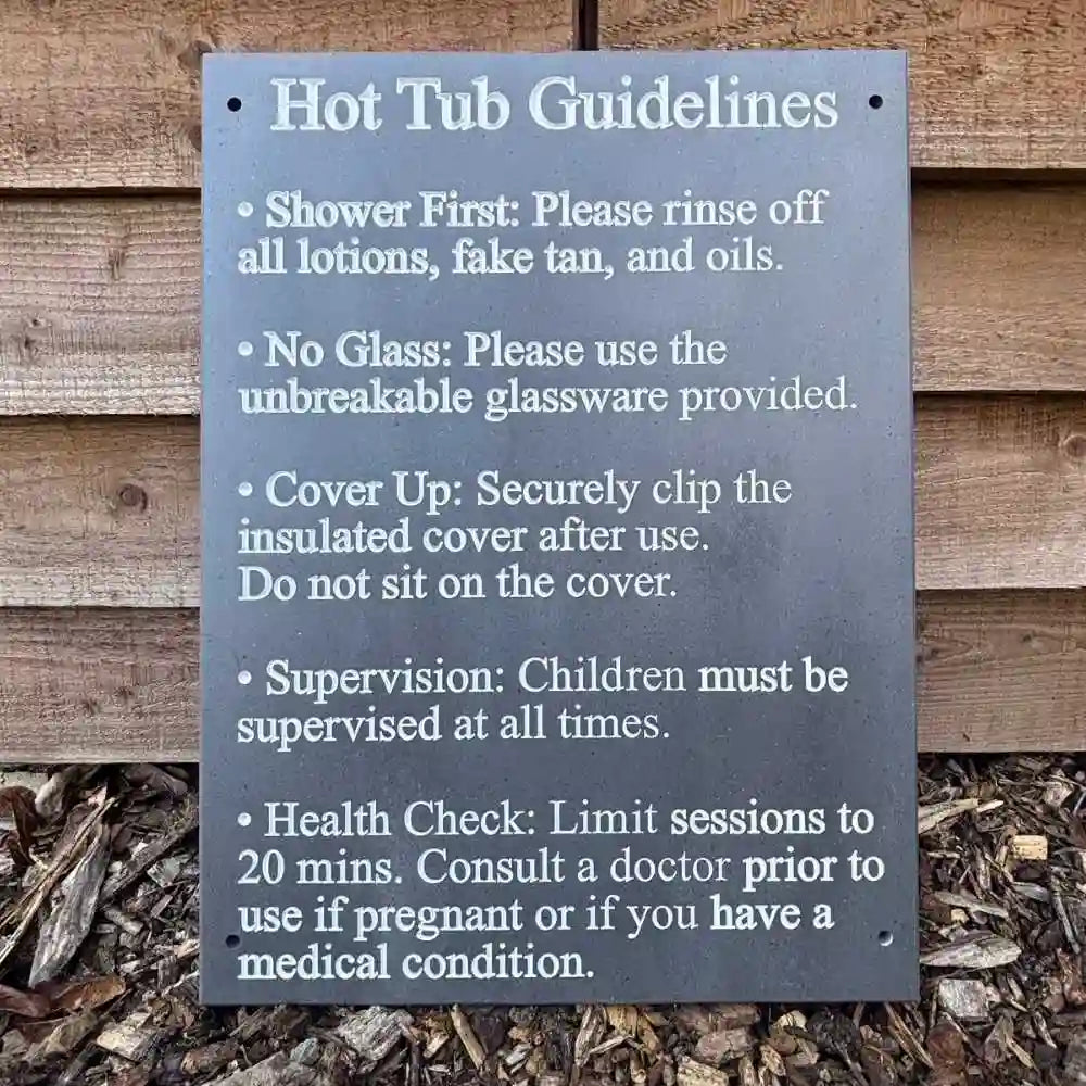 Hot tub guidelines sign against a wooden background