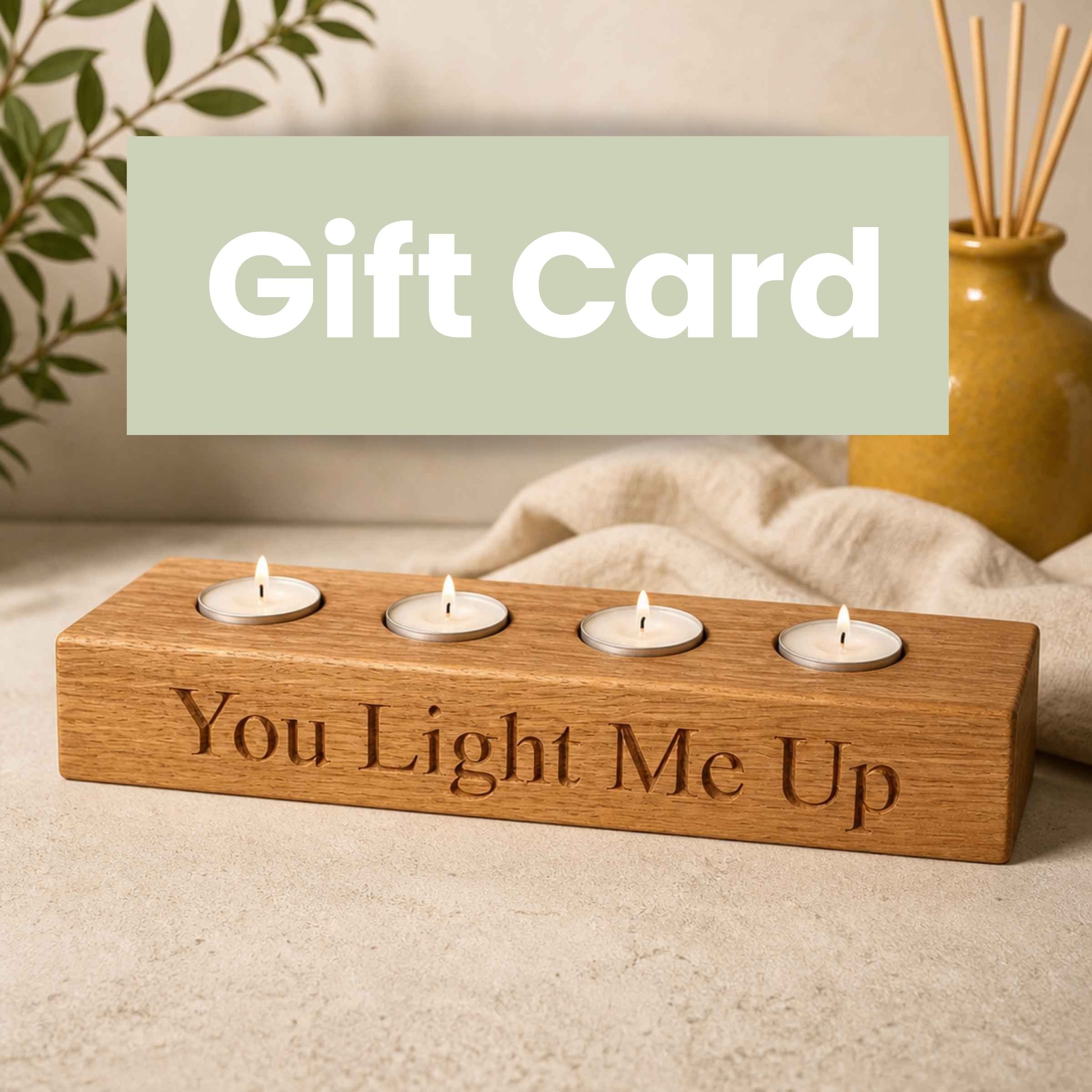 Wooden candle holder with four tealights and 'You Light Me Up' engraving, with a gift card overlay.