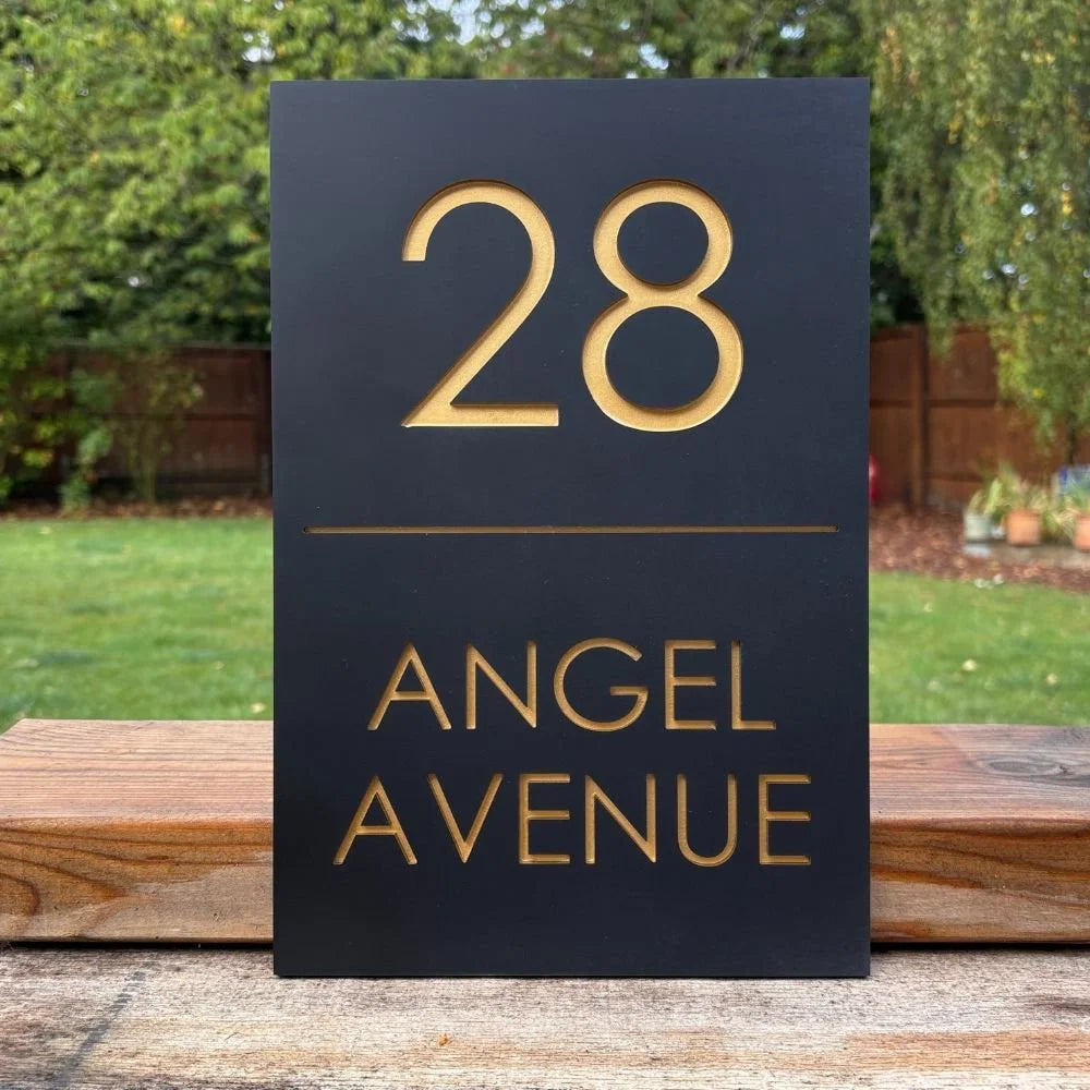 House number sign with '28 Angel Avenue' on a black background
