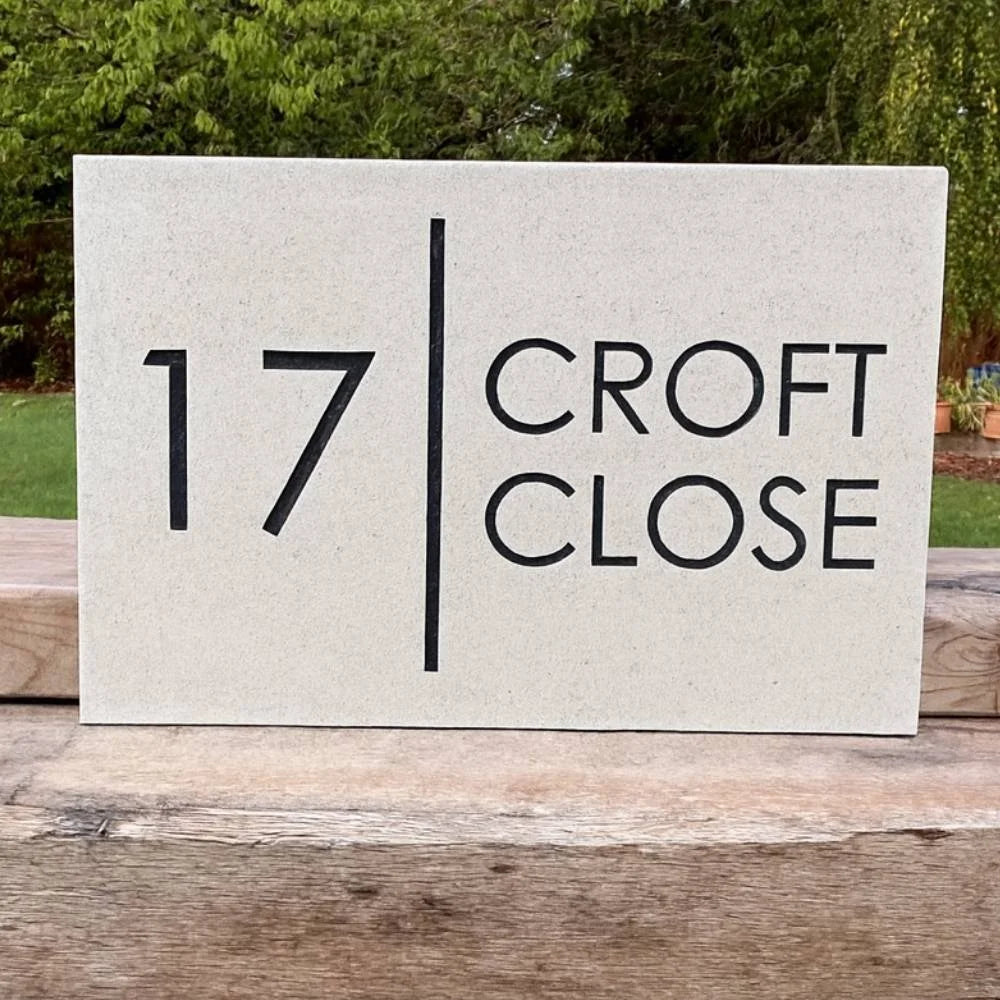 Quartz House number sign '17 Croft Close' on a wooden surface with a natural background