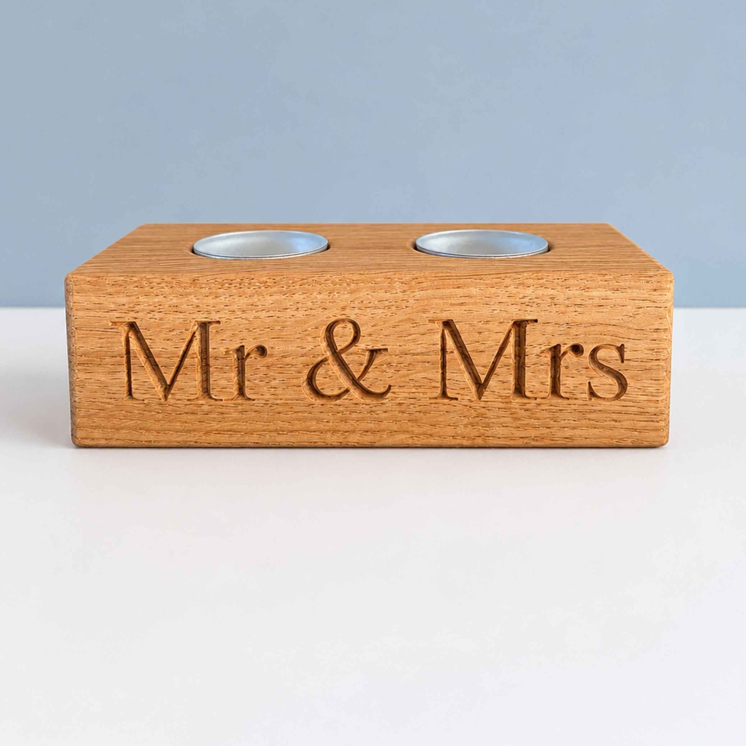 Wooden holder with 'Mr & Mrs' engraving on a white surface